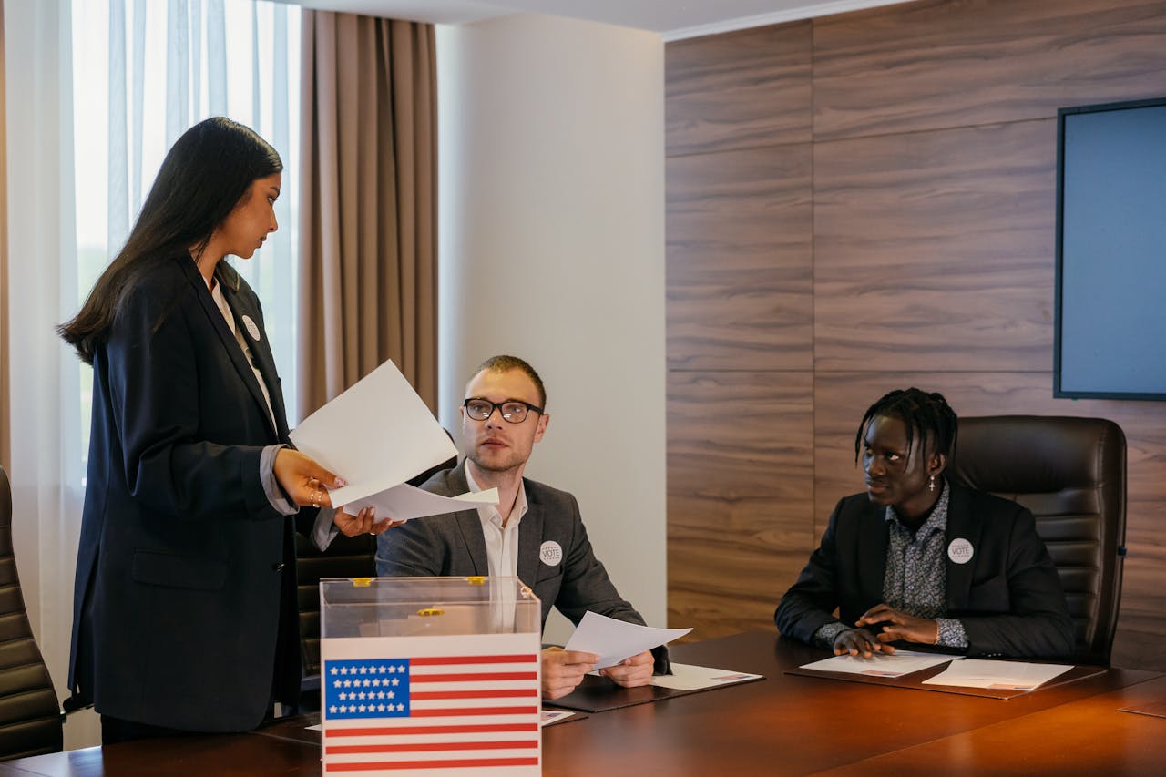Mastering the First Impression: Your intriguing post title goes here A diverse group of professionals deliberating in a conference room about election plans.